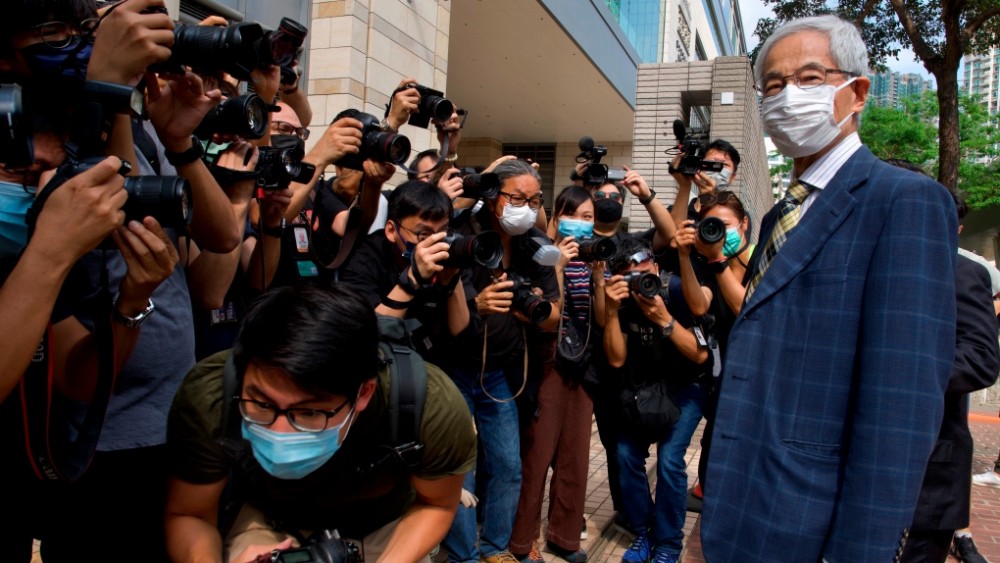 Pro-democracy lawmaker Martin Lee, right, arrives at a court in Hong Kong Thursday, April 1, 2021. (AP Photo/Vincent Yu)