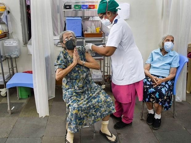 A woman reacts as she gets a Covid-19 vaccine at Nair Hospital in Mumbai on April 28, 2021. (PTI Photo)