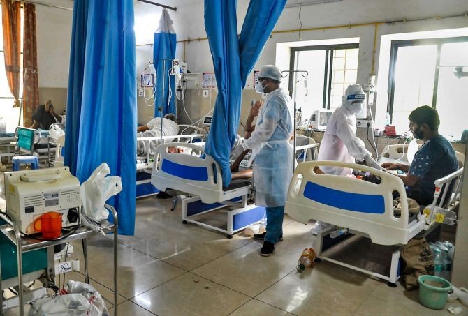 Medics check on COVID-19 patients at a hospital, amid a growing concern over shortage in supply of medical oxygen, in Sangli. Photograph: PTI Photo