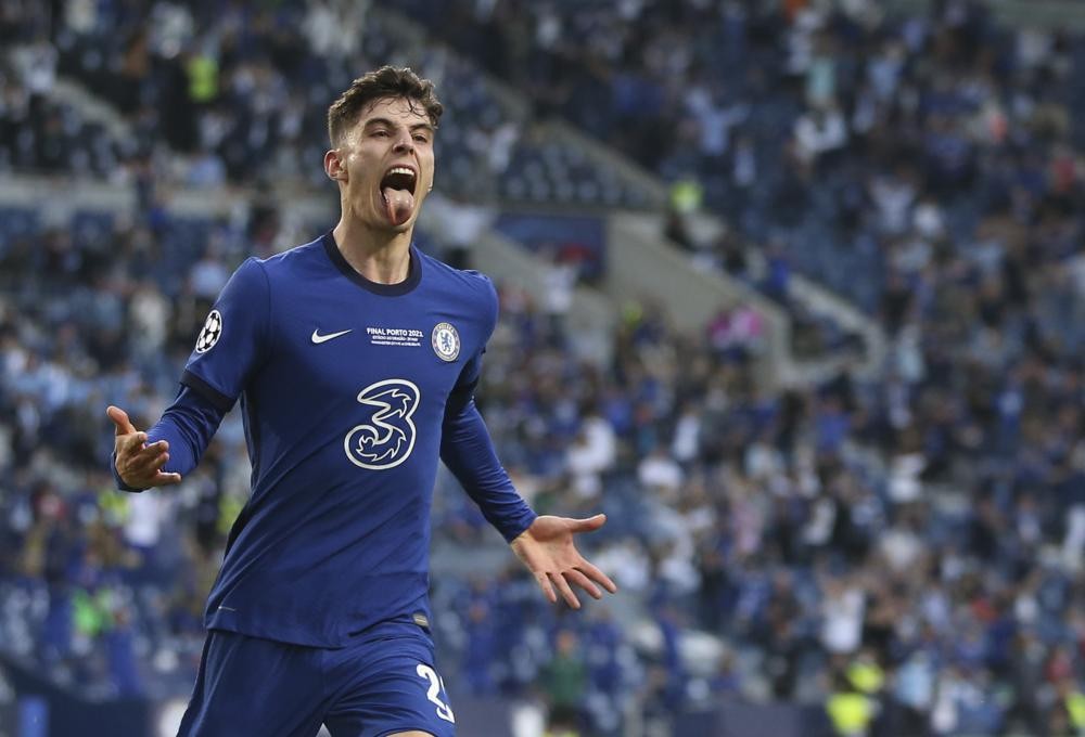 Chelsea's Kai Havertz celebrates after scoring his side's opening goal during the Champions League final soccer match between Manchester City and Chelsea at the Dragao Stadium in Porto, Portugal, Saturday, May 29, 2021. (Jose Coelho/Pool via AP)