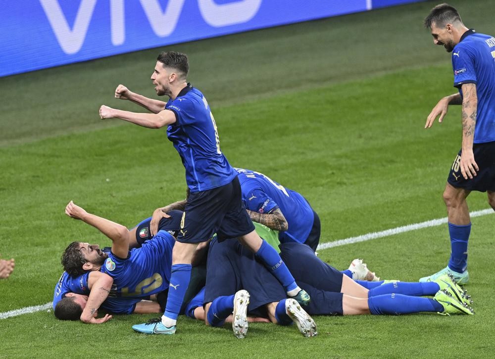 Italy's players celebrate after scoring their side's second goal during the Euro 2020 soccer championship round of 16 match between Italy and Austria at Wembley stadium in London, Saturday, June 26, 2021.(AP Photo/Justin Tallis, Pool)