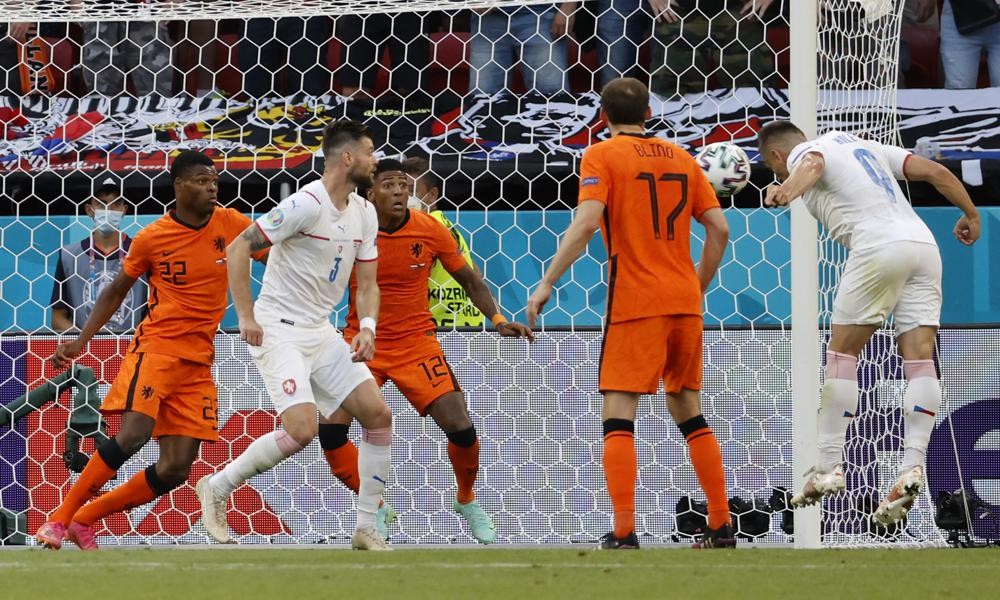 Czech Republic's Tomas Holes, right, scores his sides first goal during the Euro 2020 soccer championship round of 16 match between Netherlands and Czech Republic at the Ferenc Puskas stadium in Budapest, Hungary, Sunday, June 27, 2021. (Bernadet Szabo/Pool via AP)