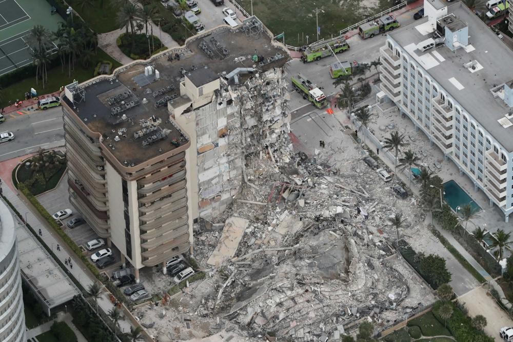 This aerial photo shows part of the 12-story oceanfront Champlain Towers South Condo that collapsed early Thursday, June 24, 2021 in Surfside, Fla. (Amy Beth Bennett /South Florida Sun-Sentinel via AP)