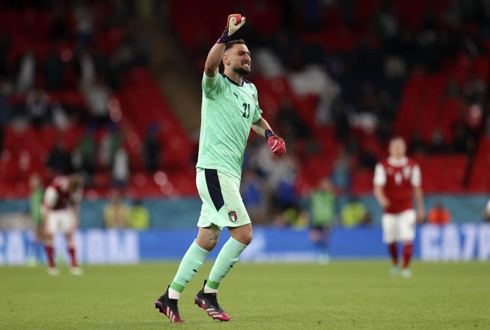 Italy's goalkeeper Gianluigi Donnarumma celebrates during the Euro 2020 soccer championship round of 16 match between Italy and Austria at Wembley stadium in London, Saturday, June 26, 2021. (Catherine Ivill/Pool via AP)