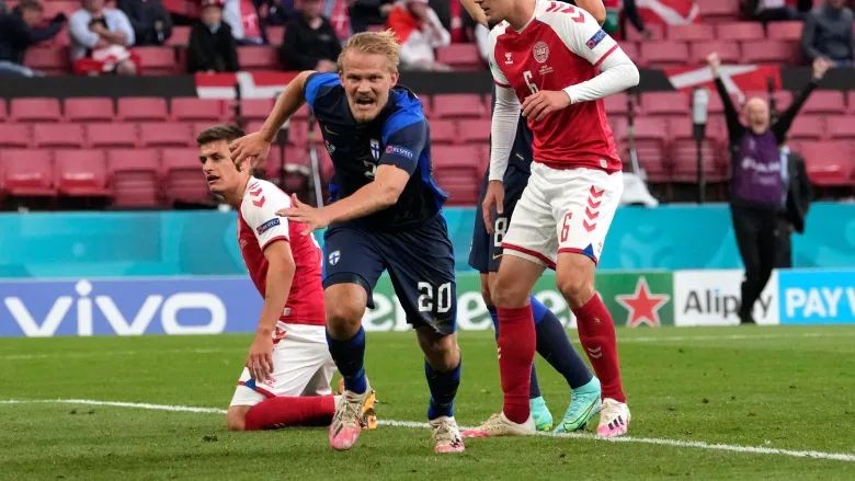 Finland's Joel Pohjanpalo (20) celebrates after scoring his side's only goal during his team's victory over Denmark in their Euro 2020 soccer championship group B match in Copenhagen on Saturday. (Martin Meissner/The Associated Press)