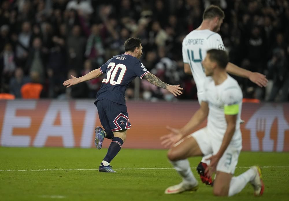 PSG's Lionel Messi celebrates after scoring his side's second goal during the Champions League Group A soccer match between Paris Saint-Germain and Manchester City at the Parc des Princes in Paris, Tuesday, Sept. 28, 2021. (AP Photo/Christophe Ena)