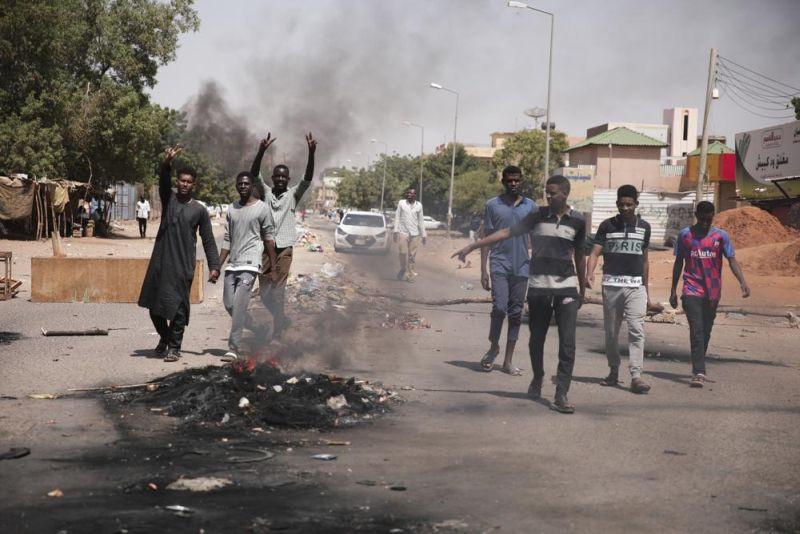 People burn tires during a protest a day after the military seized power Khartoum, Sudan on October 26, 2021. The takeover came after weeks of mounting tensions between military and civilian leaders over the course and the pace of Sudan's transition to democracy. (AP Photo)