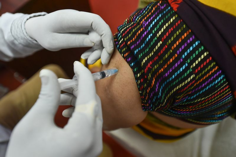 A medic administers the dose of COVID-19 vaccine to a beneficiary in New Delhi. (PTI File Photo)