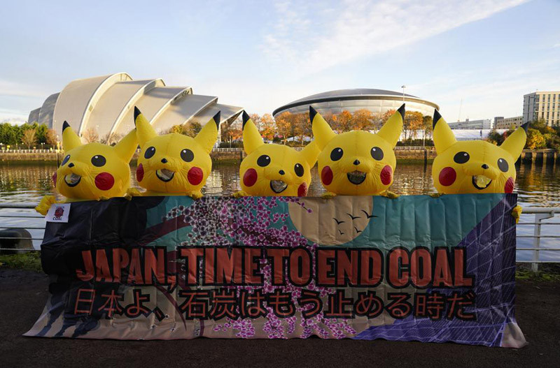 Activists dressed as the Pokemon character Pikachu protest against Japan's support of the coal industry near the COP26 U.N. Climate Summit in Glasgow, Scotland on November 4, 2021. The U.N. climate summit in Glasgow gathers leaders from around the world, in Scotland's biggest city, to lay out their vision for addressing the common challenge of global warming. (AP Photo)