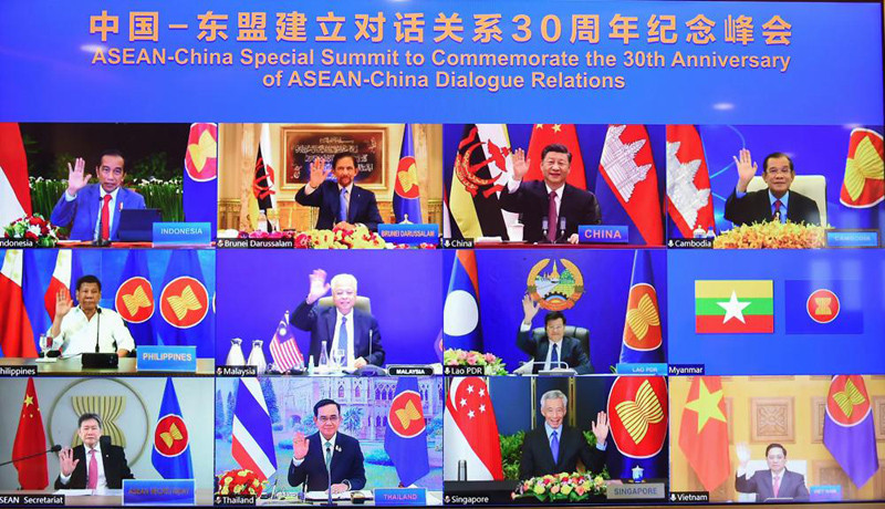 This image provided by Malaysia Prime Minister Office show ASEAN leaders and Chinese President Xi Jinping, top second from right, on screen during an online meeting of the ASEAN-China special summit in Kuala Lumpur, Malaysia, Monday, Nov. 22, 2021. Despite regional frictions, Chinese leader Xi Jinping says his country will not seek dominance over Southeast Asia or bully its smaller neighbors. Xi made the remarks Monday during a virtual conference with the 10 members of the Association of Southeast Asian Nations, known as ASEAN, marking the 30th anniversary of relations between the sides. (AP Photo)