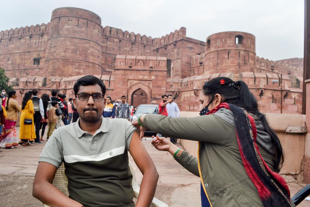 Agra: A tourist receives a dose of COVID-19 vaccine outside Agra Fort during World Heritage Week, Saturday, Nov. 20, 2021. (PTI Photo)