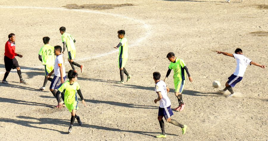 Kuthur FC players in neon jersey Vs Paopong FC in white jersey in the last league match of the 29th LMT, Tuensang. (Morung Photo)