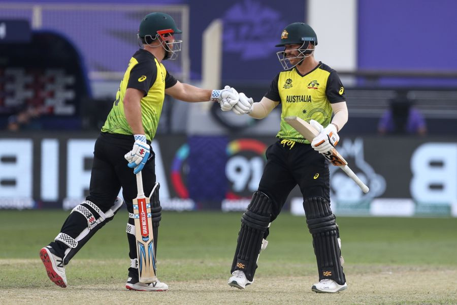 Dubai: Australia's captain Aaron Finch, left, gestures to teammate David Warner during the Cricket Twenty20 World Cup match between Australia and Bangladesh in Dubai, UAE, Thursday, Nov. 4, 2021.AP/PTI Photo