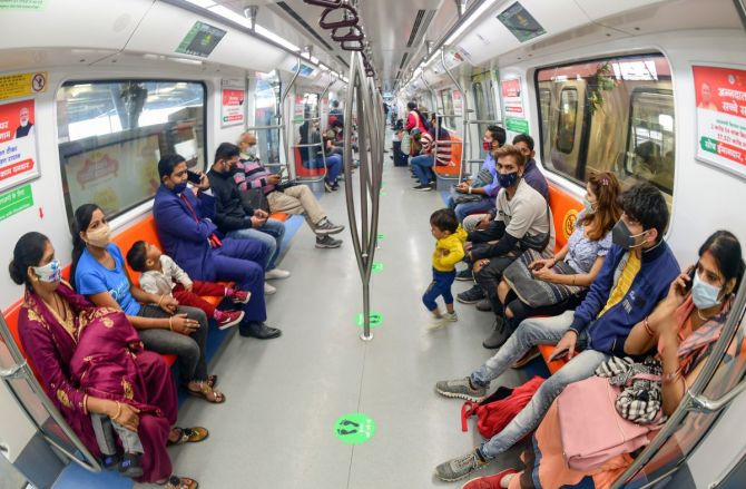 Commuters travel in a special driverless train on the Delhi Metro Pink Line in New Delhi. Photograph: Kamal Kishore/PTI Photo