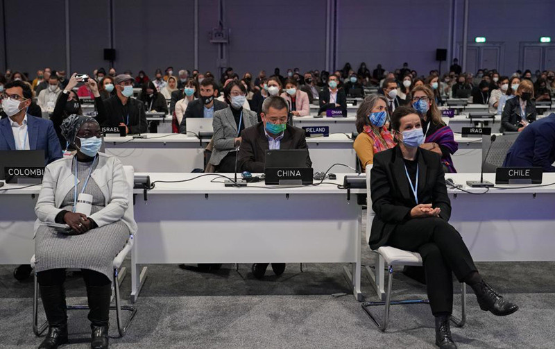 Delegates pack the hall at the COP26 U.N. Climate Summit in Glasgow, Scotland on November 11, 2021. (AP Photo)