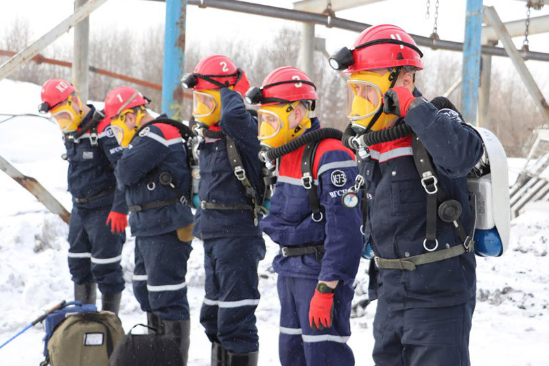 n this Russian Emergency Situations Ministry Thursday, Nov. 25, 2021 photo, rescuers prepare to work at a fire scene at a coal mine near the Siberian city of Kemerovo, about 3,000 kilometres (1,900 miles) east of Moscow, Russia,. Russian authorities say a fire at a coal mine in Siberia has killed nine people and injured 44 others. Dozens of others are still trapped. A Russian news agency says the blaze took place in the Kemerovo region in southwestern Siberia. (AP Photo)