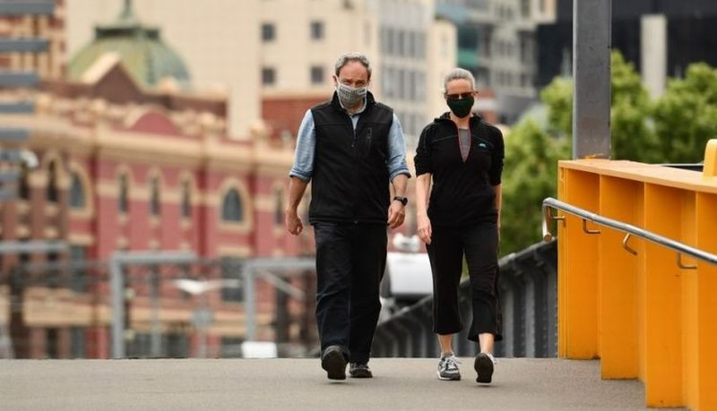Sydney: People wearing masks walk in CBD of Melbourne, Victoria, Australia, on Oct. 19, 2020. (Photo by Bai Xue/Xinhua/IANS)