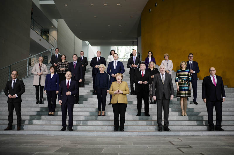 German Chancellor Angela Merkel, center, poses with her government after the cabinet meeting at the chancellery in Berlin, Germany on November 24, 2021. Due to the schedule of coalition talks for a new German government it is probably her last cabinet session as German Chancellor. (AP/PTI Photo)