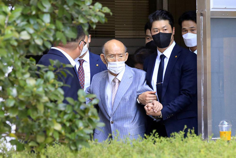 Former South Korean President Chun Doo-hwan, center, comes out of his house to attend his trial on the charge of libel in Seoul, South Korea, on Aug. 9, 2021. Former South Korean military strongman Chun, who crushed pro-democracy demonstrations in 1980, has died on Tuesday, Nov. 23, 2021. He was 90. (AP File Photo)