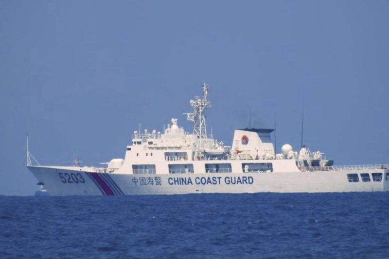 In this photo provided by the Philippine Coast Guard, a Chinese Coast Guard vessel is seen patrolling in the South China Sea, taken sometime April 13-14, 2021. Chinese coast guard ships blocked and used water cannons on two Philippine supply boats heading to a disputed shoal occupied by Filipino marines in the South China Sea, provoking an angry protest against China and a warning from the Philippine government that its vessels are covered under a mutual defense treaty with the U.S., Manila’s top diplomat said Thursday, Nov. 18, 2021. (AP File Photo)