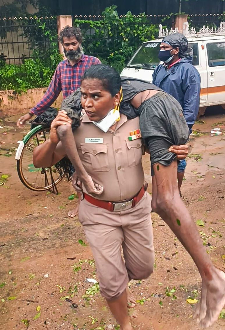 ON THURSDAY, NOV. 11, 2021** Chennai:  T.P. Chattram Police Station Inspector Rajeswari rushed to the spot and rescued Udayakumar who was lying unconscious, in Chennai. (PTI Photo)