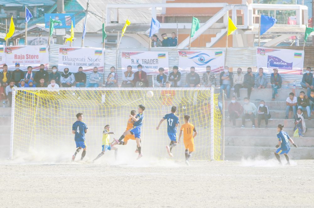 Players of Freezing FC (orange) and N-MUSC (blue) in the ongoing 29th LMT in parade ground, Tuensang. (Morung Photo)