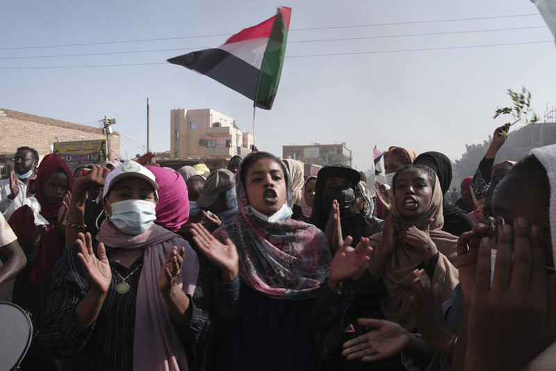 Sudanese protest against the military coup that ousted government last month, in Khartoum, Sudan, Wednesday, Nov. 17, 2021. Prime Minister Abdalla Hamdok is currently under house arrest in the capital of Khartoum. He and more than 100 other government officials were detained during the coup. Many have been kept in undisclosed locations. (AP Photo)