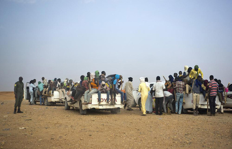 This June 14, 2018, file photo shows Nigeriens and third-country migrants head towards Libya from Agadez, Niger. The more than 66,000 United Nations peacekeepers are confronting greater threats today because conflicts have become more complex and are driven by an increasing number of factors ranging from ethnic tensions and the impact of organized crime to illegal exploitation of resources and terrorism, the U.N. peacekeeping chief said Friday, Nov. 19, 2021. (AP File Photo)