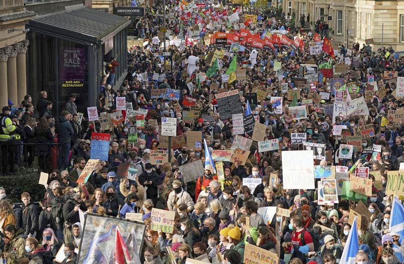 Climate activists march during a demonstration in the center of Glasgow, Scotland on November 5, 2021, which is the host city of the COP26 U.N. Climate Summit. A protest is taking place as leaders and activists from around the world are gathering in Scotland's biggest city for the U.N. climate summit, to lay out their vision for addressing the common challenge of global warming. (AP/PTI Photo)