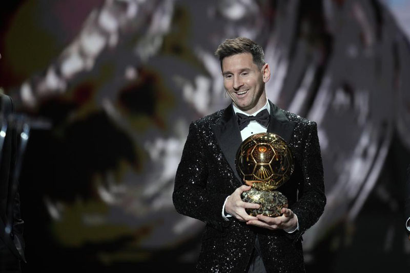 PSG player Lionel Messi reacts after winning the 2021 Ballon d'Or trophy during the 65th Ballon d'Or ceremony at Theatre du Chatelet, in Paris, Monday, Nov. 29, 2021. Messi won the Ballon d'Or for seventh time. (AP Photo)