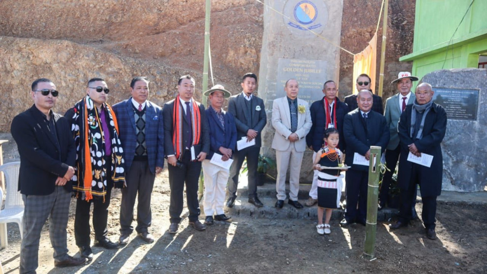 Dr Chotisuh Sazo with others after unveiling the monolith of TYSWO golden jubilee at Thenyizu village on December 14. (Morung Photo)
