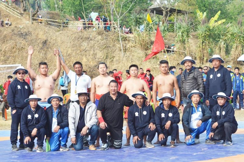 Thepfüchütuo Khrodi is seen here with other wrestlers and officials.