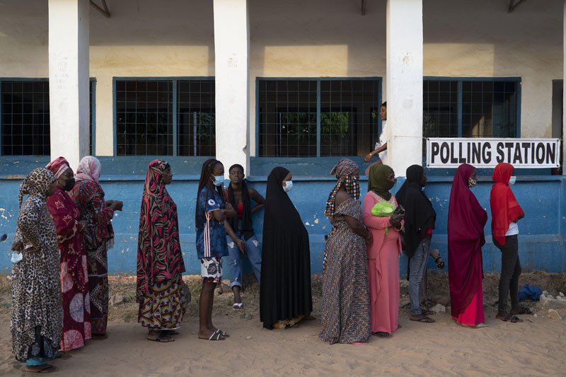 People line up to cast their ballot for Gambia's presidential elections in Bakau, Gambia on December 4, 2021. Gambians vote in a historic election that will for the first time not have former dictator Yahya Jammeh, who ruled for 22 years, on the ballot. (AP/PTI Photo)