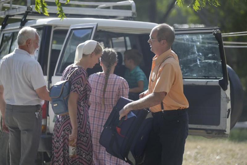 Unidentified people board a vehicle departing to the airport from the Christian Aid Ministries headquarters at Titanyen, north of Port-au-Prince, Haiti, Dec. 16, 2021. Twelve remaining members of a U.S.-based missionary group who were kidnapped two months ago have been freed, according to the group and to Haitian police. (AP Photo)
