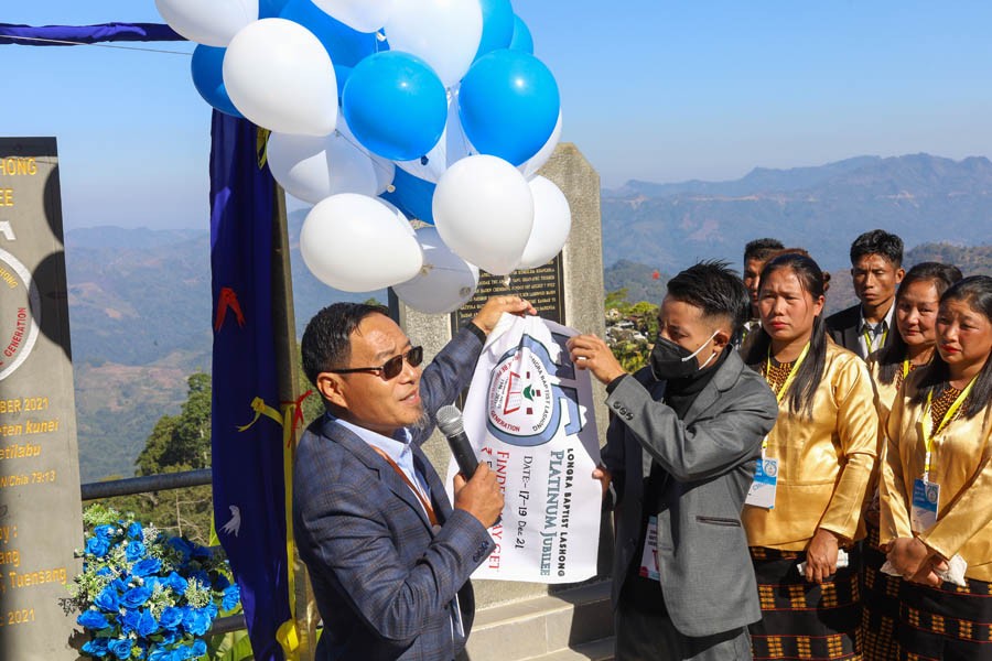 Rev Achu Chang, Executive Secretary, Chang Baptist Lashong Thangyen unveil the monolith and released the peace flag to commemorate Platinum Jubilee of Longra Baptist Church. (Morung Photo)