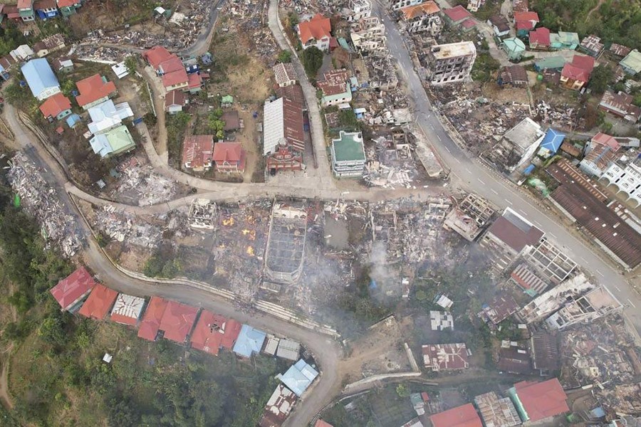 In this aerial photo released by the Chin Human Rights Organization, fires destroy numerous buildings in the town of Thantlang in Chin State in northwest Myanmar, on December 4, 2021. More than 580 buildings have been burned since September, according to satellite image analysis by Maxar Technologies. (AP Photo)