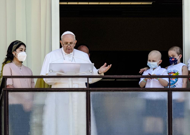 Pope Francis appears with young oncologic patients on a balcony of the Agostino Gemelli Polyclinic in Rome, July 11, 2021. Pope Francis is celebrating his 85th birthday Friday, Dec. 17, 2021, a milestone made even more remarkable given the coronavirus pandemic, his summertime intestinal surgery and the weight of history: His predecessor retired at this age and the last pope to have lived any longer was Leo XIII over a century ago. (AP File Photo)