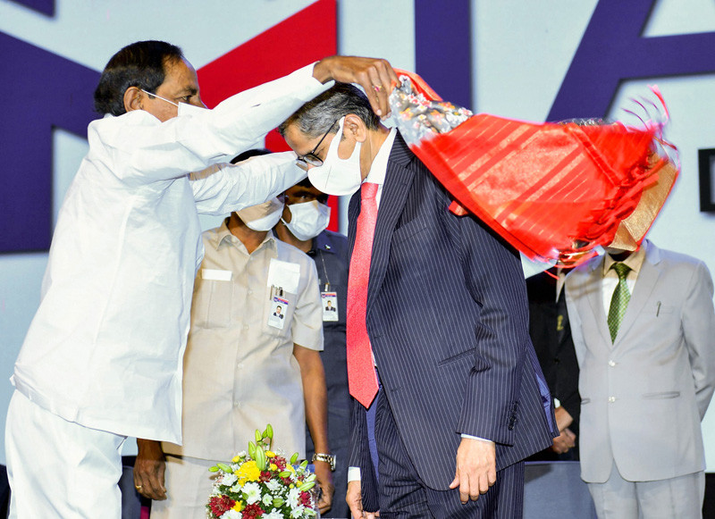 Telangana Chief Minister K Chandrashekar Rao felicitates Chief Justice of India N V Ramana, during the Curtain Raiser and Stakeholder's Conclave of International Arbitration and Mediation Centre (IAMC), in Hyderabad on December 4, 2021. (PTI Photo)