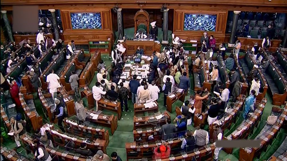 New Delhi: Opposition MPs protest in the Lok Sabha during the Winter Session of Parliament, in New Delhi, Monday, Dec. 20, 2021. (LSTV/PTI Photo)(