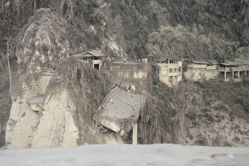 Remains of a bridge is seen in a slope, destroyed by the flowing lava by the eruption of Mount Semeru in Lumajang, East Java, Indonesia on December 5, 2021. The death toll from eruption of the highest volcano on Indonesia's most densely populated island of Java has risen with scores still missing, officials said Sunday as rain continued to pound the region and hamper the search. (AP/PTI Photo)