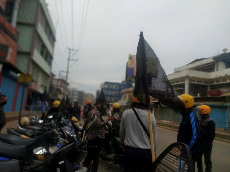 Dimapur District Two-wheeler Taxi Association, in solidarity and also demanding justice for the victims of December 4 Oting village incident, hoisted black flags and undertook a peaceful rally in Dimapur on December 6. (Morung Photo)