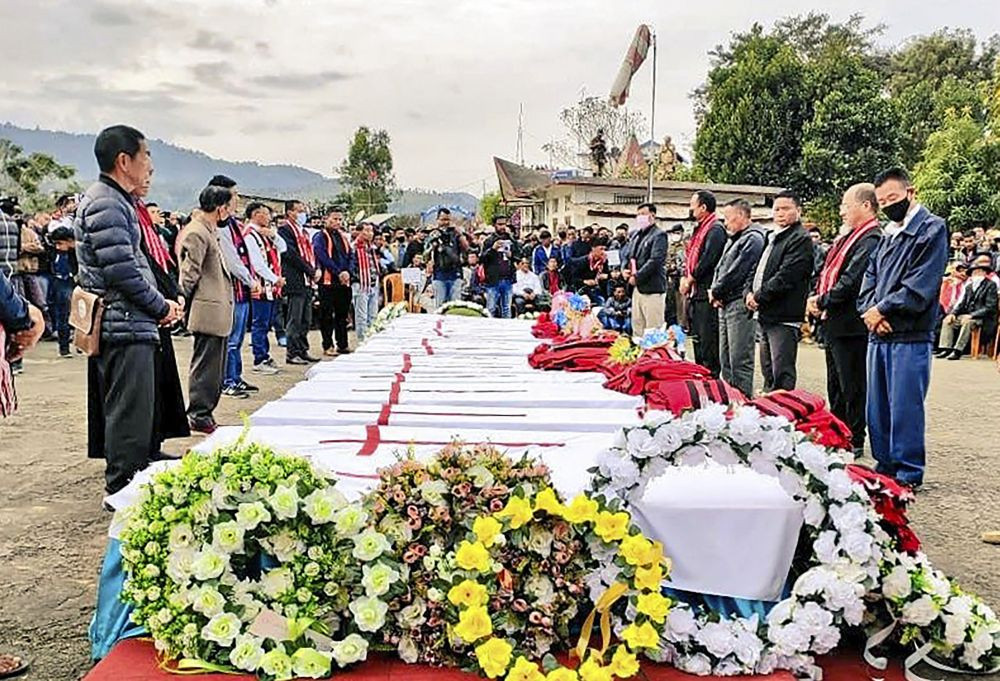 Mon: Relatives and locals pay last tributes to the 13 people who were allegedly killed by Armed Forces, in Mon district, Monday, Dec. 6, 2021. (PTI Photo)
