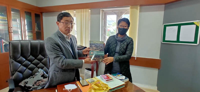 Sentiyanger lmchen, IAS, ACS & Finance Commissioner releases the ‘Survey on the number of villages in Nagaland 2021’  in his office chamber, Secretariat, Kohima on December 21.