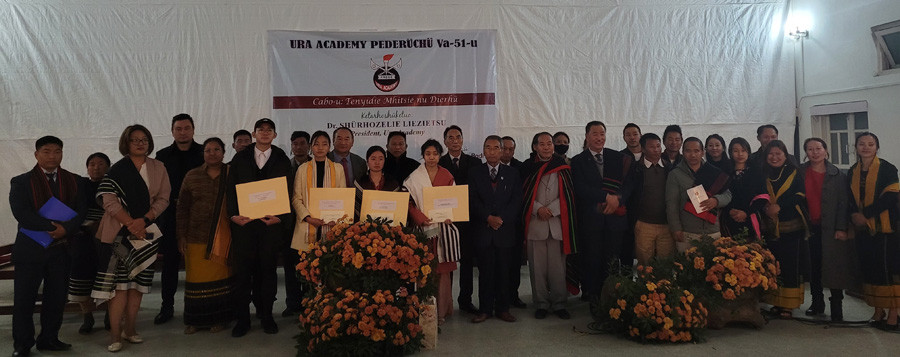 Dr Shürhozelie Liezietsu and others with awardees of academic excellence during 51st seminar of Ura Academy on December 16 in Kohima. (Morung Photo)