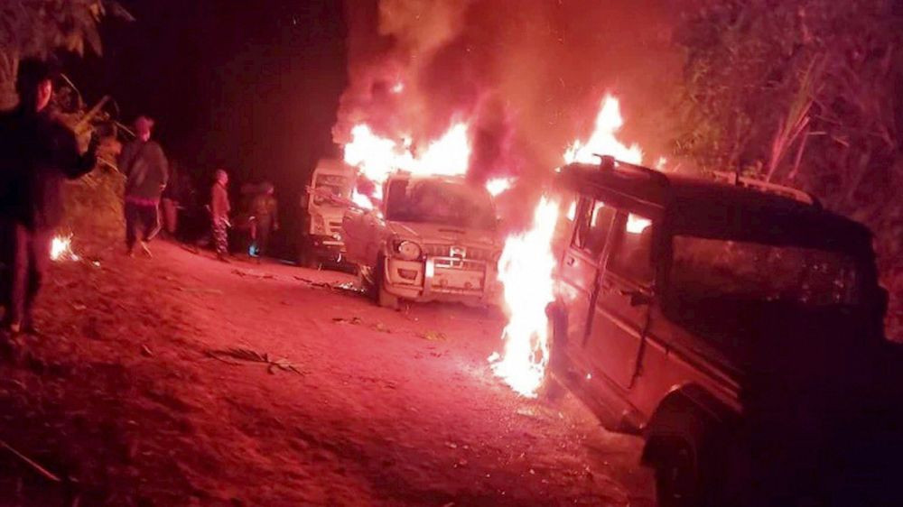 Mon: Angry villagers burn vehicles belonging to security personnel  at Oting village under Mon district of Nagaland, Saturday night, Dec. 4, 2021. (PTI Photo)