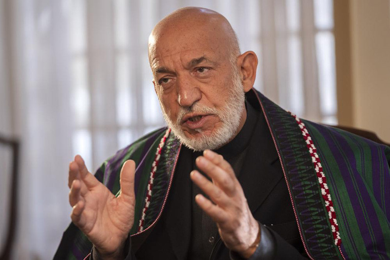Former President of Afghanistan Hamid Karzai speaks during an interview with the Associated Press in Kabul , Afghanistan on Friday, Dec. 10, 2021. (AP Photo)