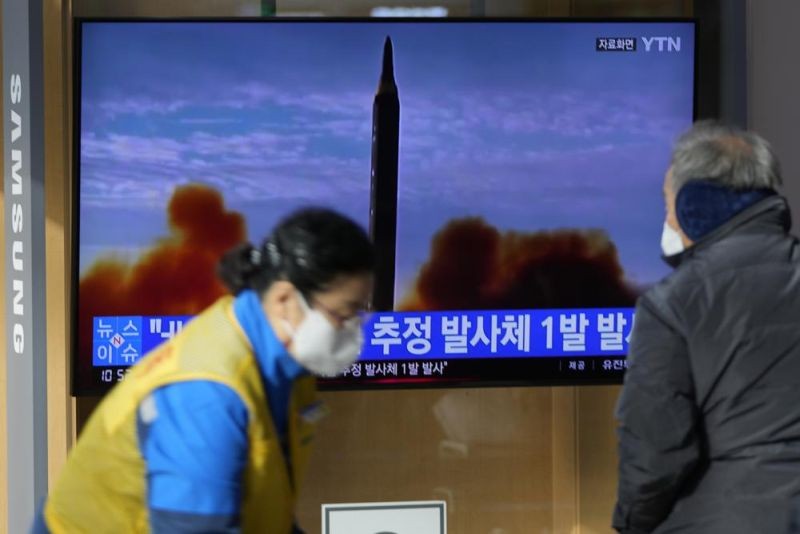 People stand near a TV screen showing a news program reporting about North Korea's missile with file footage at a train station in Seoul, South Korea, Wednesday, Jan. 5, 2022. North Korea fired a suspected ballistic missile into the sea on Wednesday, the South Korean and Japanese militaries said, its first public weapons launch in about two months and a signal that Pyongyang isn't interested in rejoining denuclearization talks anytime soon and would rather focus on boosting its weapons arsenal. (AP Photo)