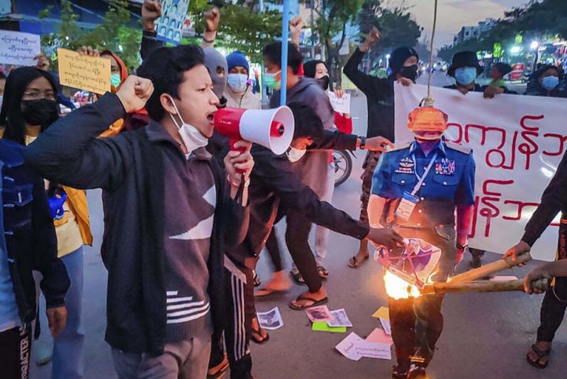 Protesters burn an effigy of State Administration Council Chairman Sen. Gen. Min Aung Hlaing and an image of Cambodia Prime Minister Hun Sen in Mandalay, Myanmar, on Jan. 3, 2022, during a rally against the upcoming visit to Myanmar by the Cambodian leader who is also the current chair of the ASEAN regional bloc. Prime Minister Hun Sen begins a visit to strife-torn Myanmar on Friday, Jan. 7, that he hopes will invigorate efforts by Southeast Asian nations to start a peace process, but critics say will legitimize the rule of the military that took power last year and its campaign of violence. (AP Photo)