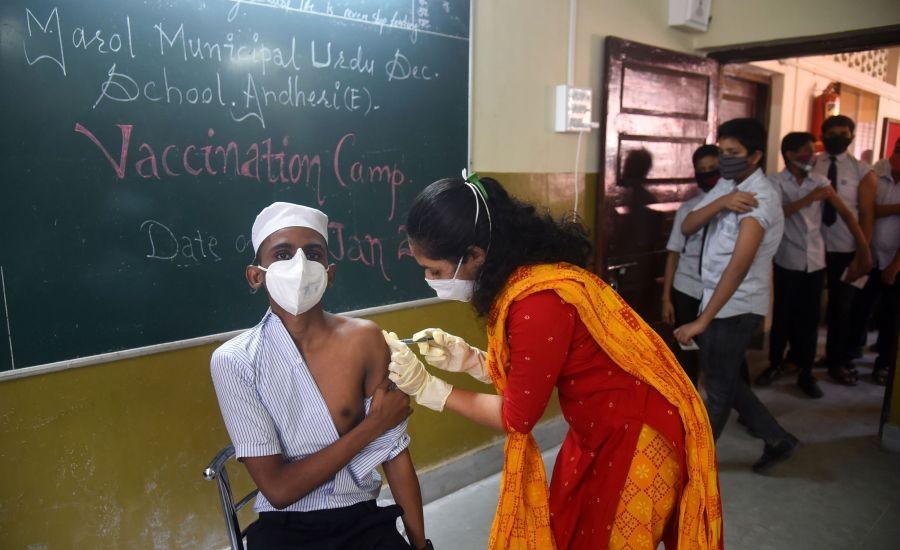 Mumbai: A health worker administers a dose of Covid-19 vaccine to a student, at a BMC school at Andheri, in Mumbai, Friday, January 21, 2022. (PTI Photo)
