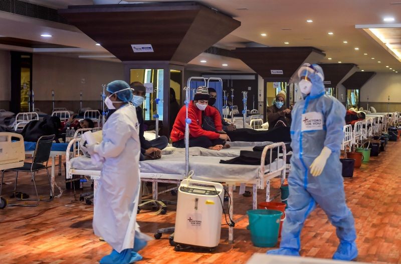 COVID-19 patients undergo treatment inside the Shehnai Banquet Hall, a COVID-19 care facility, in New Delhi on January 20, 2022. (PTI Photo)